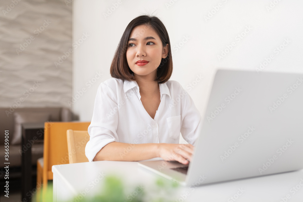 Asian business lady working in a random cafe Asian business lady working in a random cafe