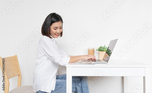 Asian business lady working in a random cafe