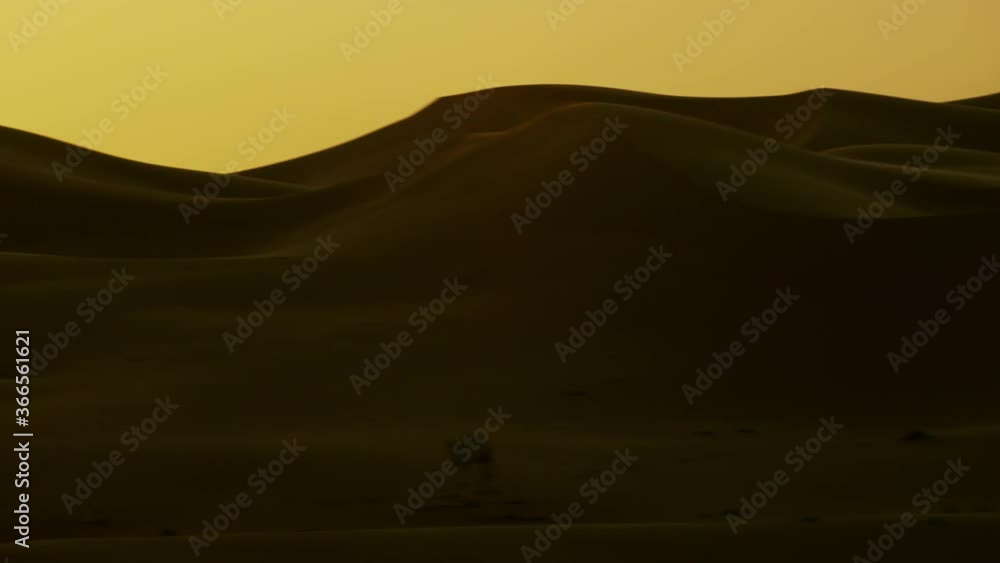 Beautiful sunset over mountains of sand dunes in the desert Dubai UAE ...