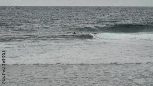Wallpaper Mural Surfers Enjoying The Rough Sea Waves Rolling In The Ocean In Siargao, Philippines On A Gloomy Day. - wide shot Torontodigital.ca
