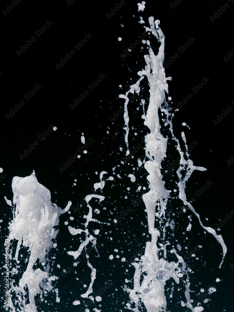 Obraz premium abstract splash of a jet of water on a black background