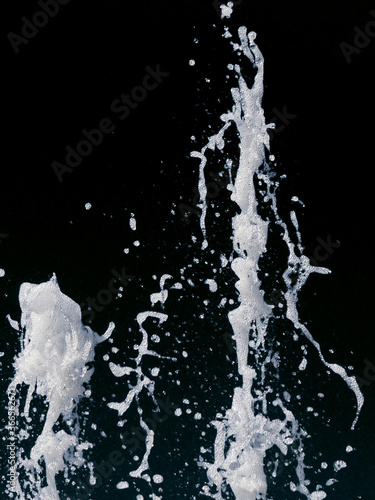 abstract splash of a jet of water on a black background