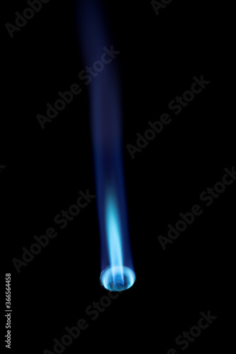 Obraz na plátně Flamethrower burner gas blow torch Ignition with blue fire flame at black backgr