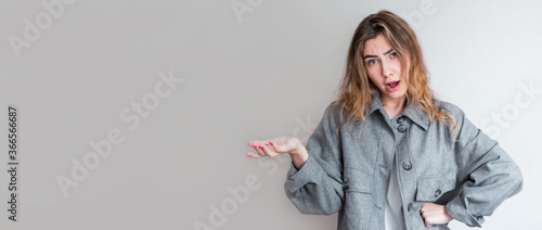 Portrait of a furious woman isolated over grey background