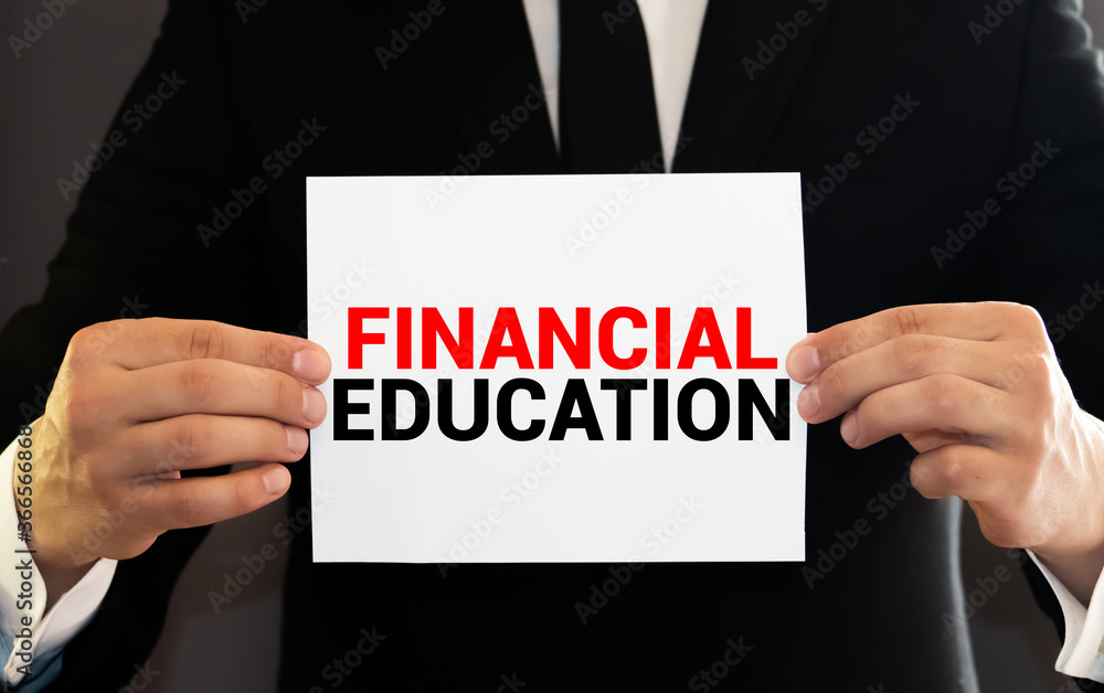 man have a paper with word financial education man have a paper with word financial education