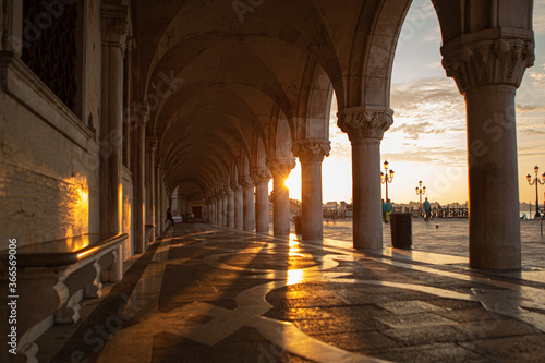 Morning Light Flares and Shadows Cascade Across Ancient Marble Pillars along the Grand Canal in Venice Italy 02