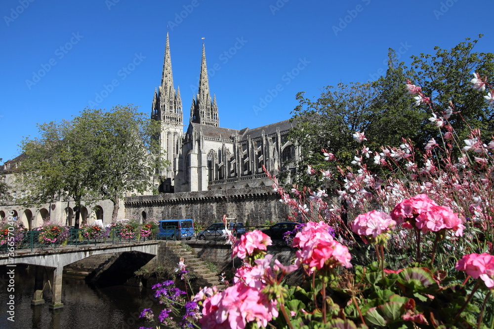 Quimper town in Brittany France. Wall of old town and a beautiful garden near the Cathedral of Saint Corentin. Tourism in France. Quimper town in Brittany France. Wall of old town and a beautiful garden near the Cathedral of Saint Corentin. Tourism in France.