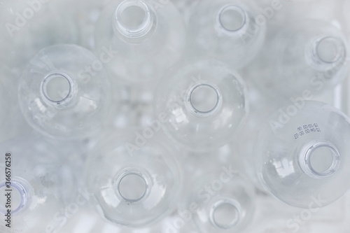 Plastic bottles in a box on a white background