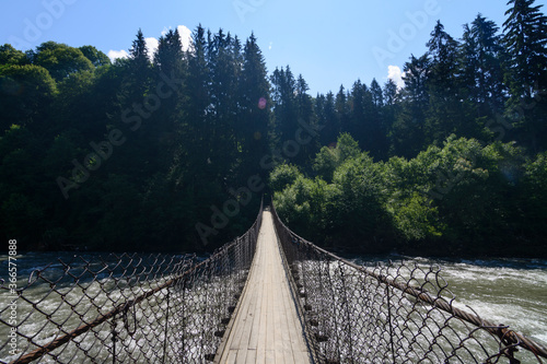 Fototapeta Naklejka Na Ścianę i Meble -  suspension bridge over the river