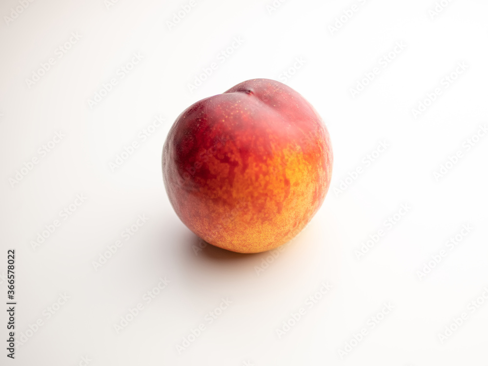 Peach, nectarine on a white background. Red and yellow. Peach, nectarine on a white background. Red and yellow.