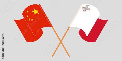 Crossed and waving flags of Malta and China