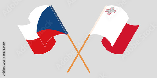 Crossed and waving flags of Malta and Czech Republic