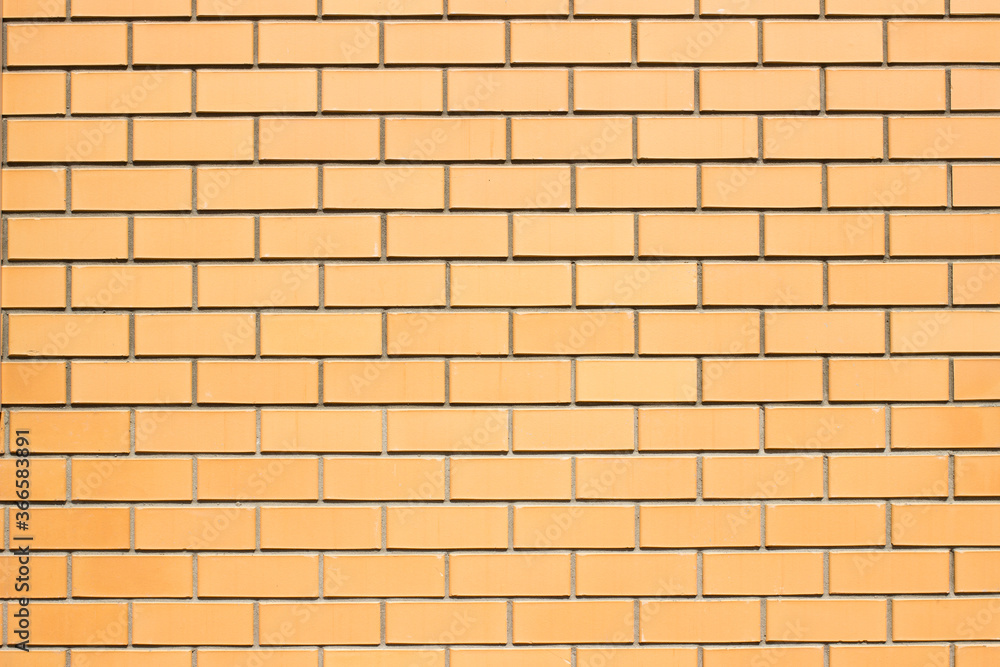 Brickwork background. New brick wall texture of orange color. Neat smooth brickwork. Brickwork background. New brick wall texture of orange color. Neat smooth brickwork.