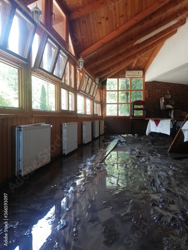 Ruined restaurant interiors. flooding damages, big damage done by a small mountain river that overflows after heavy rainfall
