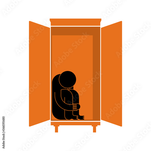 Man is sitting in cupboard. Loneliness and resentment concept. Fear