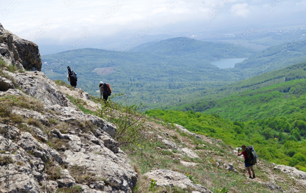 Group of people hiking a mountain trail