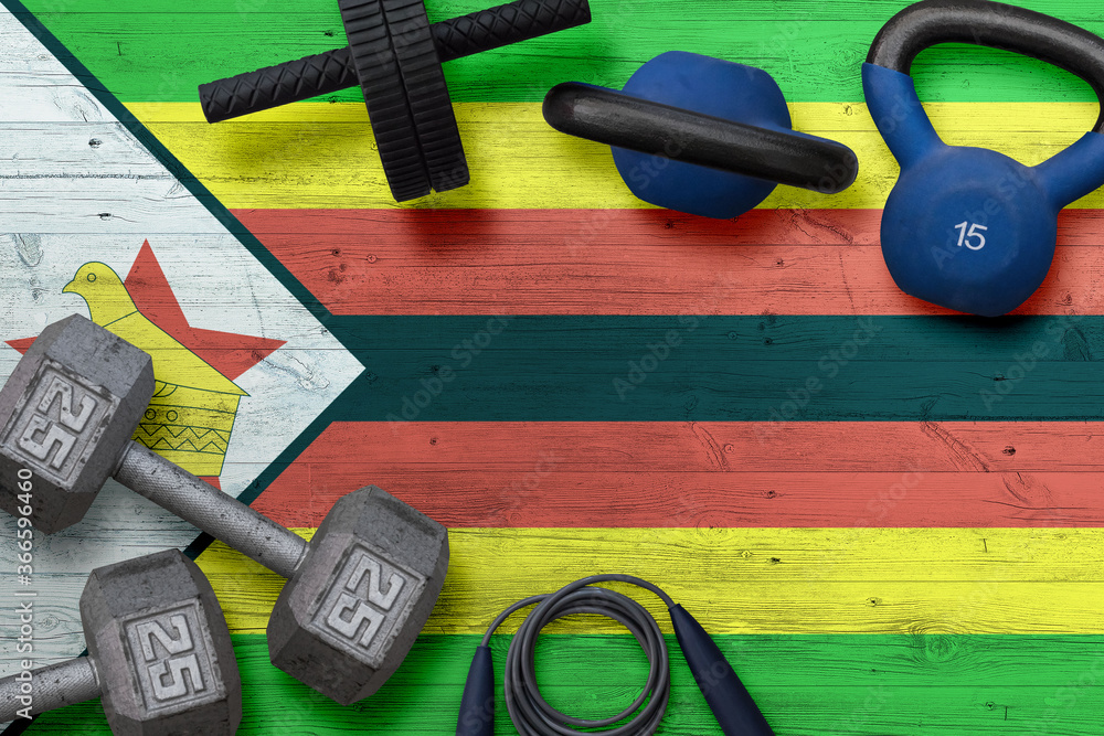 Zimbabwe sports club concept. Top view of heavy weight plates with iron