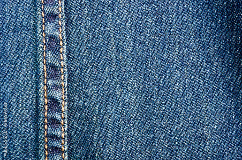 clothing items blue stonewashed faded jeans cotton fabric texture with seams, clasps, buttons and rivets, macro, close-up clothing items blue stonewashed faded jeans cotton fabric texture with seams, clasps, buttons and rivets, macro, close-up