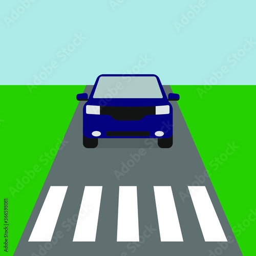 
Blue car rides on the road before a pedestrian crossing