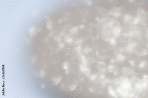 Macrophotography of Glass shiny ball isolated on white background in blurred style.