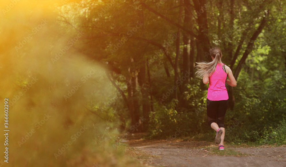 Young fitness woman running in the morning forest trail. Healthy fit living. Young fitness woman running in the morning forest trail. Healthy fit living.