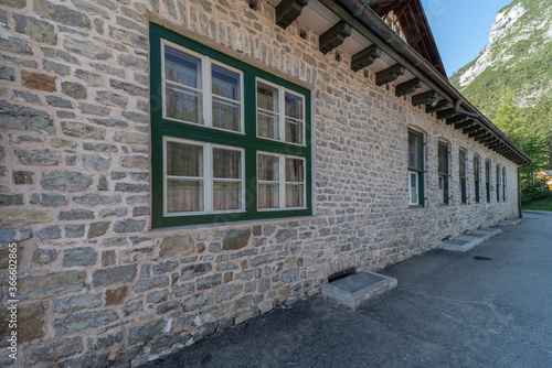 Fototapeta Naklejka Na Ścianę i Meble -  Series of windows lined up on a building of clear stones