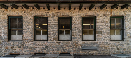Series of windows lined up on a building of clear stones