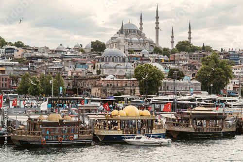 Historical eminönü district market and its fishermen, one of the symbols of Istanbul City with Suleymaniye Mosque behind.