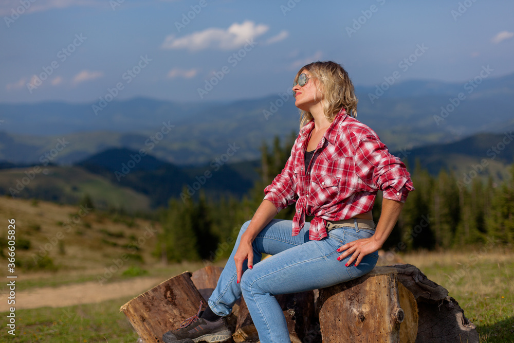 cute girl in denim clothes in the carpathian mountains cute girl in denim clothes in the carpathian mountains