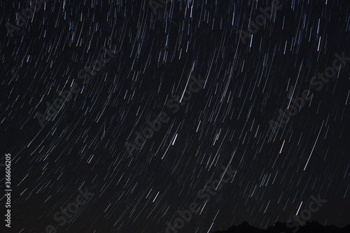 Wallpaper Mural A view of the stars of the Milky Way with a mountain top in the foreground. Night sky nature summer landscape. Perseid Meteor Shower observation Torontodigital.ca