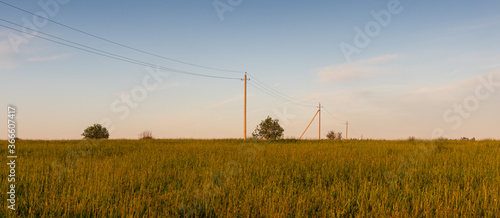 high-voltage wires lead into the distance