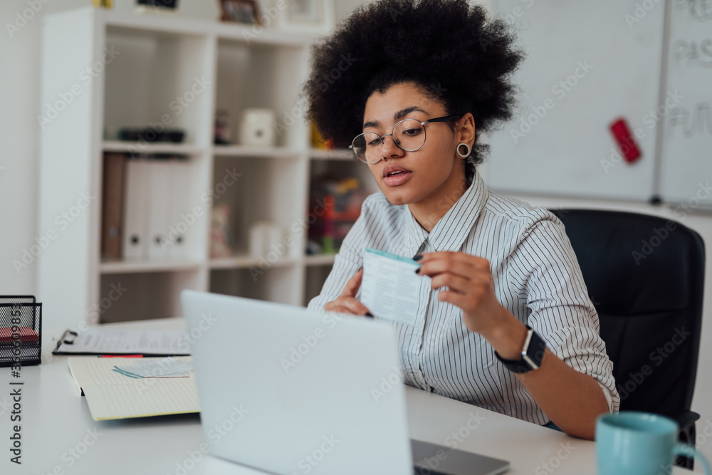 Virtual Classroom. Young afro american female teacher explaining something while teaching through webcam at home Virtual Classroom. Young afro american female teacher explaining something while teaching through webcam at home