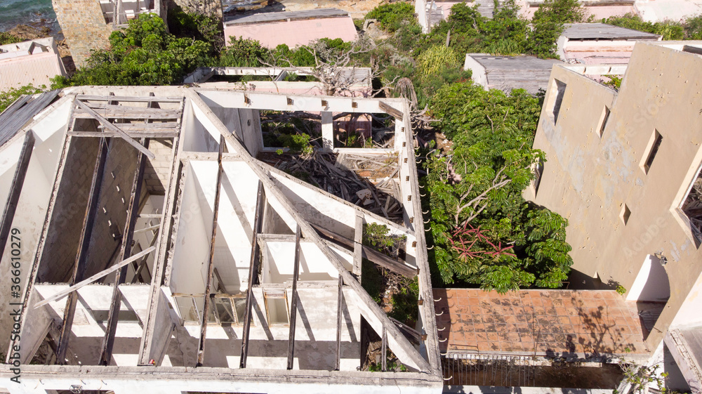 Worn down damage building due to hurricanes and natural disasters. Worn down damage building due to hurricanes and natural disasters.