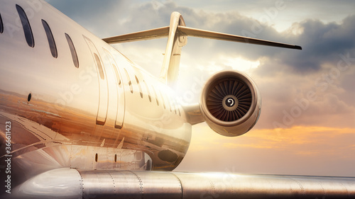 private jet against a sunset