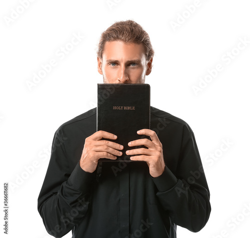 Handsome priest with Bible ...