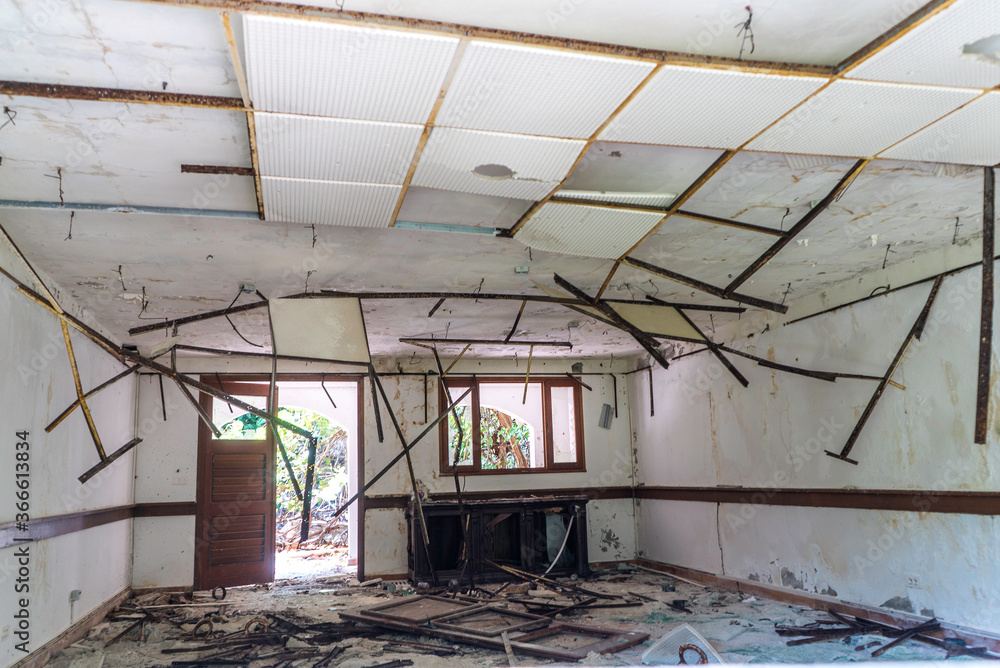 Worn down damage building due to hurricanes and natural disasters. Worn down damage building due to hurricanes and natural disasters.