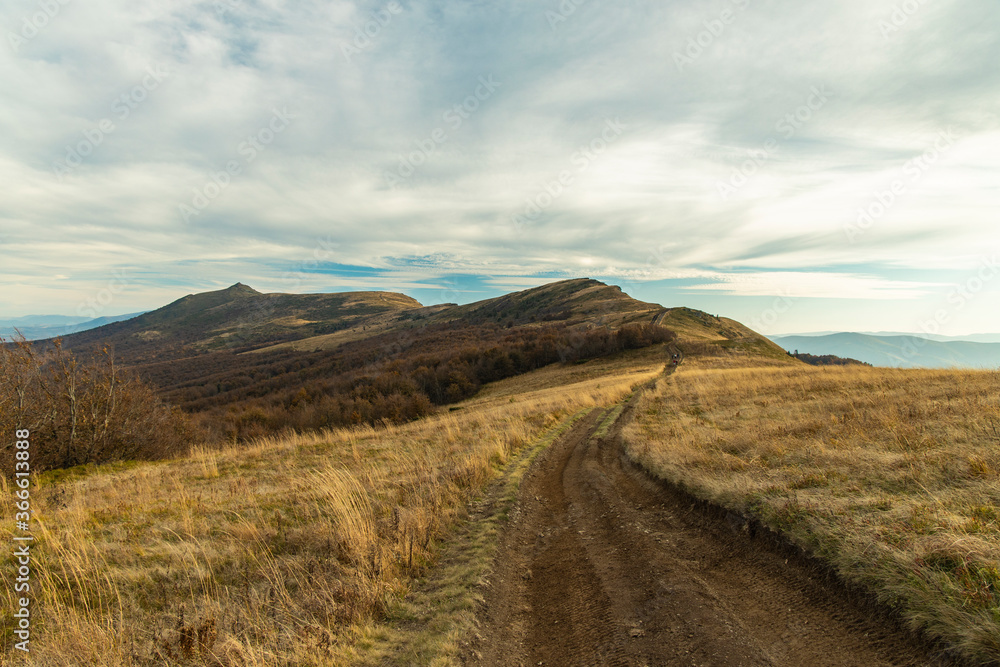 moody dirty gray empty mountains landscape highland nature scenic view of autumn cloudy weather time and lonely dirt trail