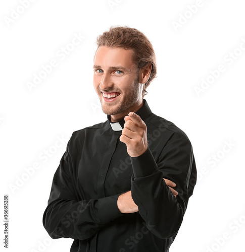 Handsome priest on white ba...