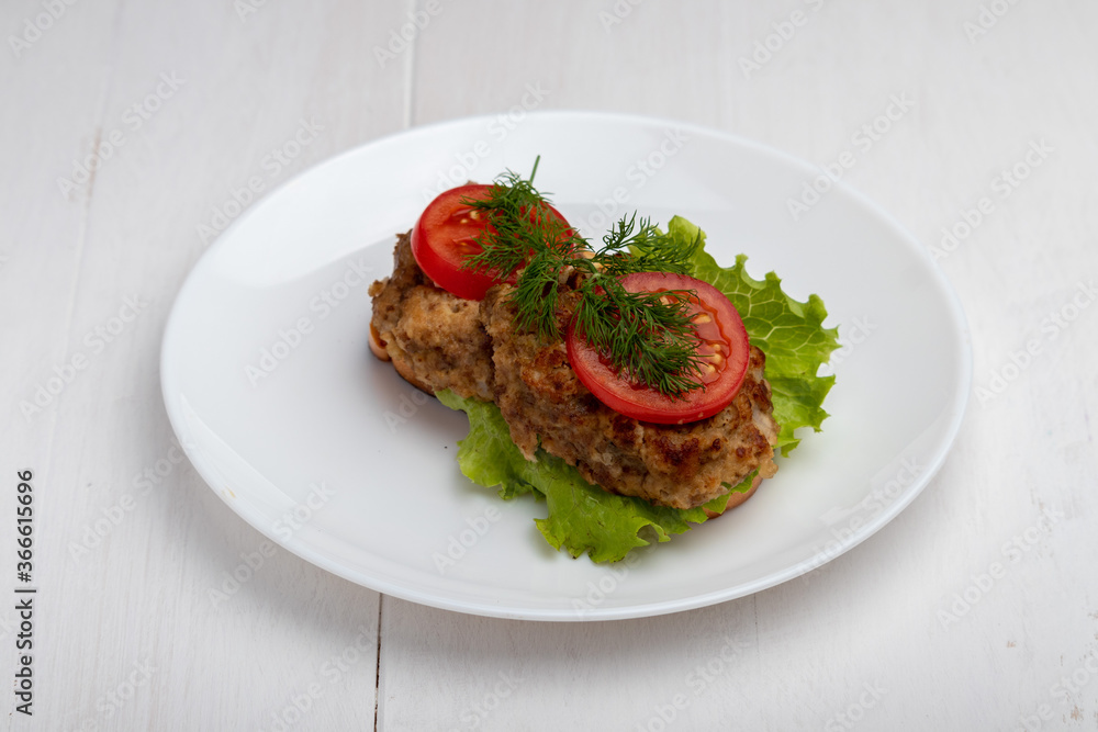sandwich with cutlet lettuce and tomato slices sandwich with cutlet lettuce and tomato slices