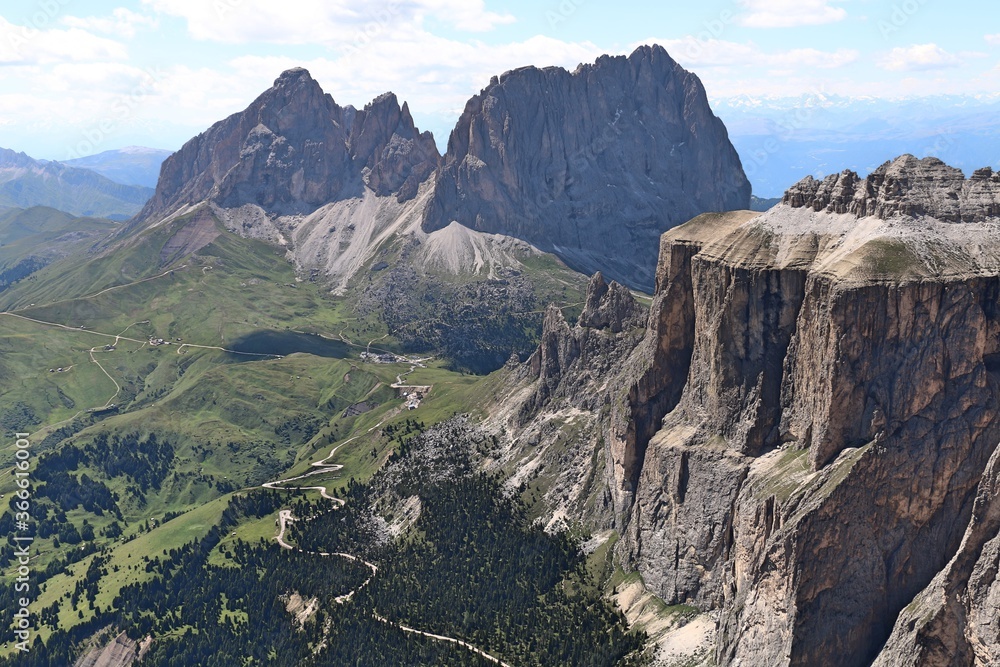 Obraz premium view from terrace of the dolomites to sella tower, langkofel mountain range and green valley