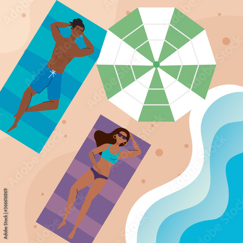 couple afro with swimsuit lying down tanning on the beach, summer vacation season