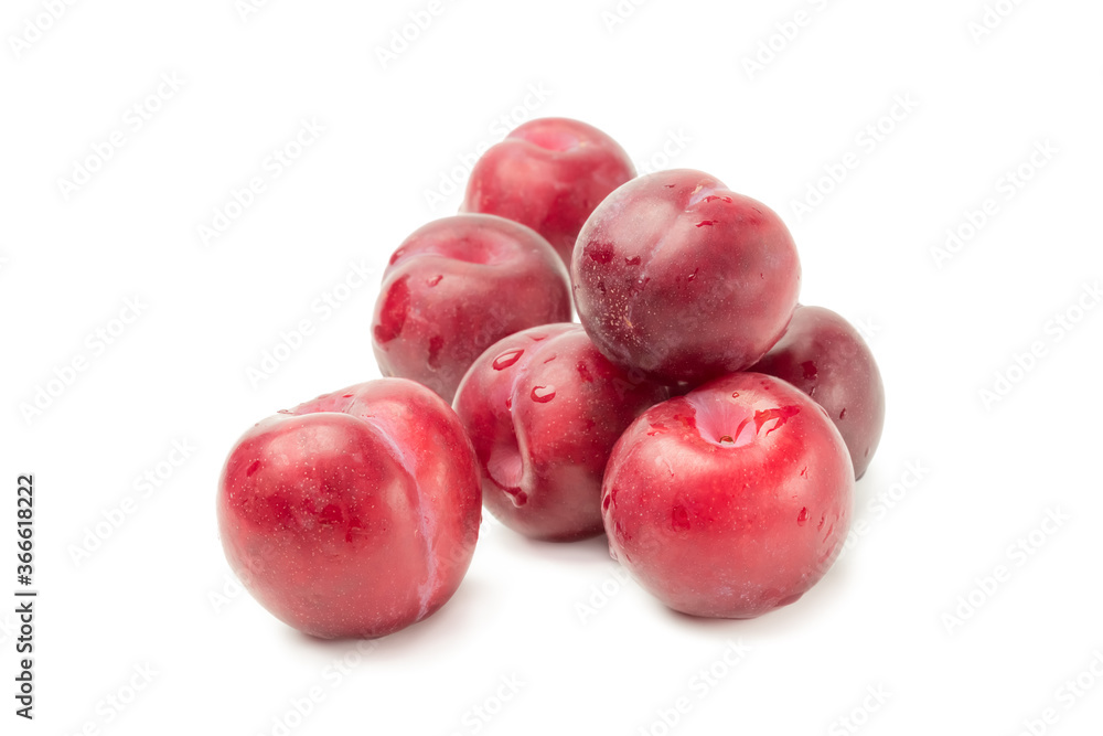 Seven red plums on white background, isolate