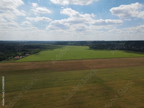Aerial view of rural summer landscape with fields and forest on a sunny day  © stoptheclocks