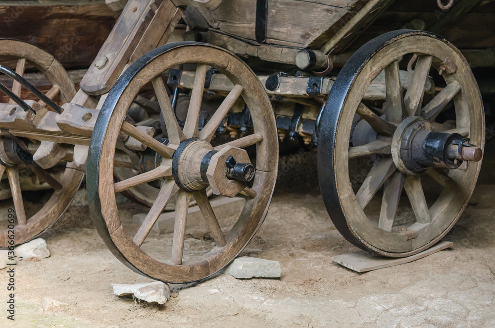 Close up of old wooden carriage wheels 