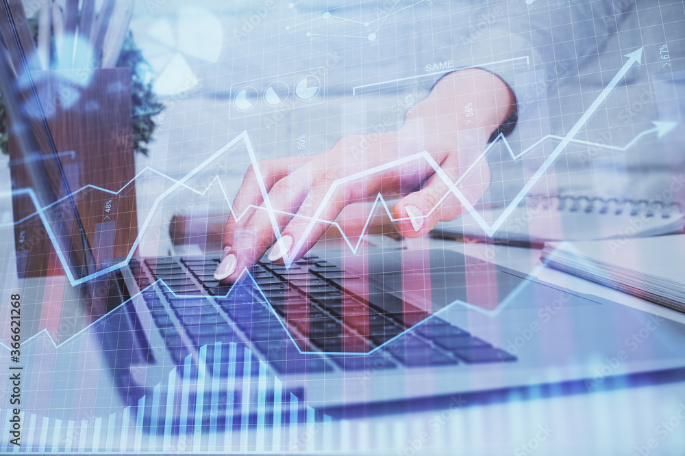 Multi exposure of woman hands typing on computer and forex chart hologram drawing. Stock market analysis concept. Multi exposure of woman hands typing on computer and forex chart hologram drawing. Stock market analysis concept.