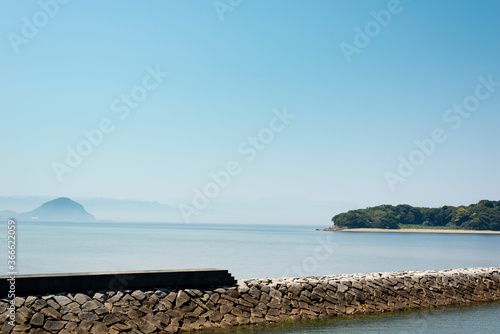 Sea and a pier with clear, blue sky in Seto inland sea in Japan