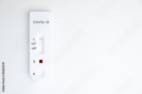 Test kit for viral disease COVID-19 2019-nCoV (coronavirus). This quick blood test shows a positive result for antigens for SARS-CoV-2 virus