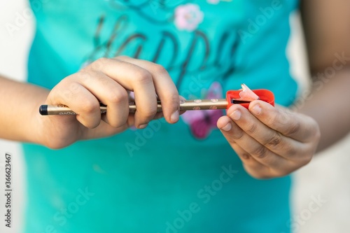 Vászonkép Shallow focus shot of a person sharpening a pencil