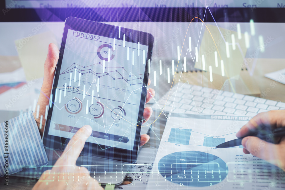Multi exposure of man's hands holding and using a phone and financial chart drawing. Market analysis concept. Multi exposure of man's hands holding and using a phone and financial chart drawing. Market analysis concept.