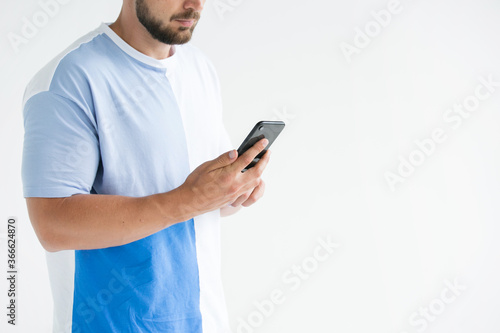 young man using a mobile phone © muse studio